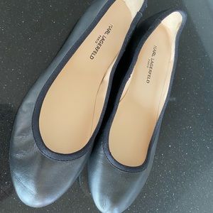 Black leather ballet flats.